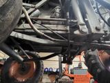 an image of a vehicle being worked on in a garage
