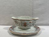 an image of a small bowl and saucer on a white table