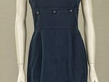 a mannequin dressed in a blue dress on display