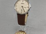 an image of a watch and a watch stand on a table