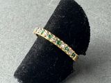 a close up of a ring on a black velvet ring holder