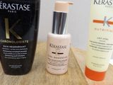 a bottle of kerastase and a tube of kerastase cream on a table