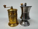 two different types of coffee grinders on a table
