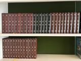 many books that are on the shelves in the room