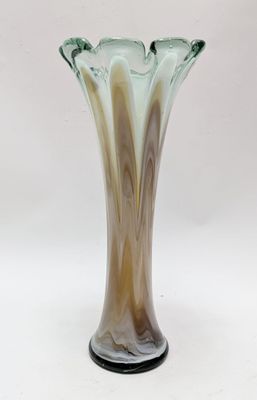 a glass vase that is sitting on a table