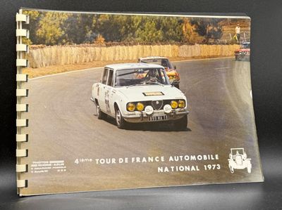 a picture of a book with a picture of a car driving down the road