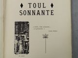 an open book with black and white illustrations on it