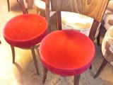 three chairs that are sitting next to each other in a room