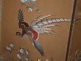 a painting of a pheasant flying over a field of flowers