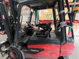 a forklift truck that is parked in a warehouse