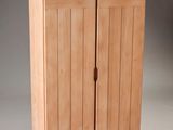 a wooden cabinet with two doors and a drawer