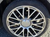 a close up of a car ' s tire on the road