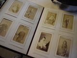 an old photo of a group of people sitting in a book