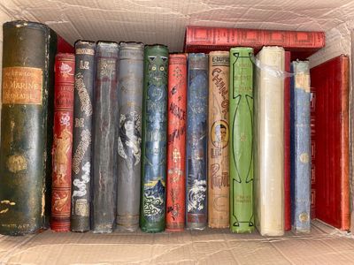 a box full of old books sitting on a table