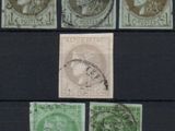 a close up of a group of stamps on a black surface