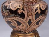 a large vase with a crown on top of it