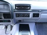the interior of a car with a steering control and a dash board