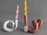 two candles that are next to each other on a table
