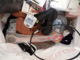 a bag full of stuff that is sitting on the floor