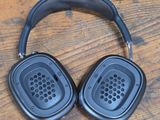 a pair of headphones sitting on a wooden table