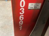 a close up of a piece of metal with a sign on it