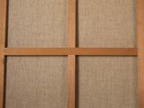 a close up of a wooden frame with a window in it