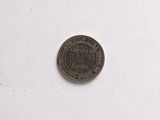 an old coin with a chinese writing on it