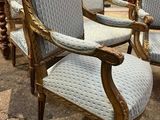 four chairs that are sitting in a room together