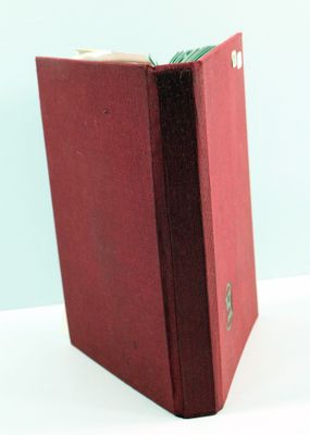 a red book that is sitting on a table