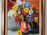 a painting of flowers in a vase on the wall