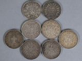 six different types of coins are arranged in a circle