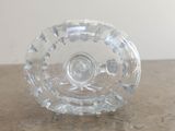 a clear glass bowl sitting on top of a table