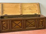 a wooden chest sitting on the floor in a room