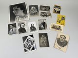 a lot of old black and white photos on the table