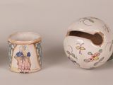 three small vases sitting next to each other on a table