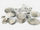 many different types of blue and white dishes and cups