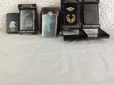 several lighters are lined up on a white surface next to a white wall
