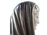 a statue of a woman with a veil on her head