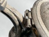 a close up of a silver tea pot on a table
