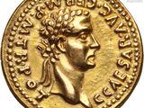 a close up of a gold coin with an image of a man on it