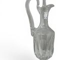 a clear glass vase with a flower on the top of it