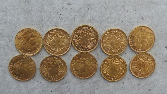 Dix pièces de monnaies en or à valeur faciale de 20 francs Suisse...