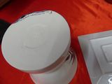 a white cake sitting on top of a red table cloth