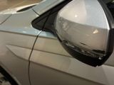 a close up of a car ' s side mirror with a reflection on it