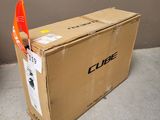 a cardboard box with an orange flag sticking out of it