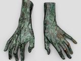 pair of bronze hands on a white background