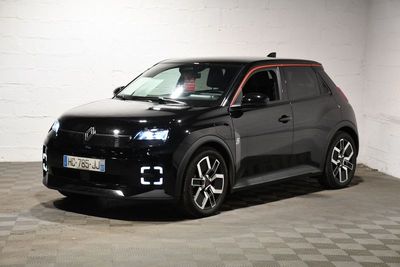 the black suv is parked in a garage with a checkered floor