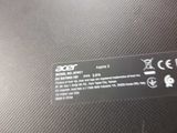 the back side of a laptop with a small sticker on it