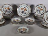a lot of plates that are sitting on a table