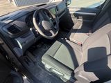 the interior of a car with the driver ' s seat down